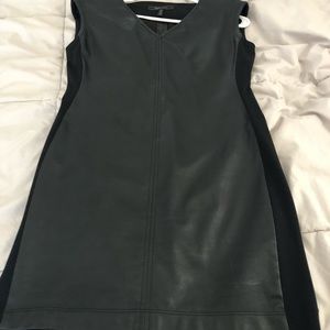 Leatherette little black dress. Zip shoulders with stretchy sides. Super stylish